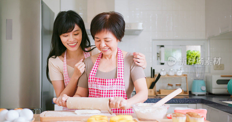 mom and daughter making bread